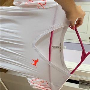 PINK white with neon orange writing shirt